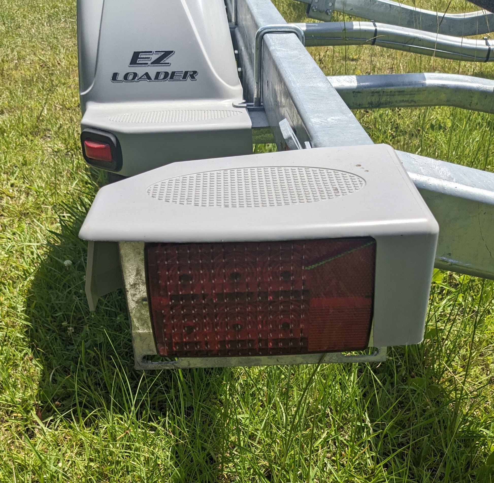 250-025173-10 Tail Light Cover Left  Side On Trailer